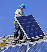 Professional Solar Panel Installer with Safety Harness