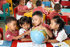 Kindergarten Kids with Globe