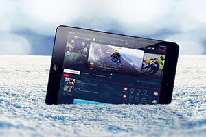2014 Sochi Olympics - NBC Streaming Live on Computer Tablet in Snow - Photo: mexrix / Shutterstock