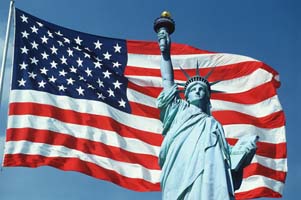 American Flag Flying with Statue of Liberty
