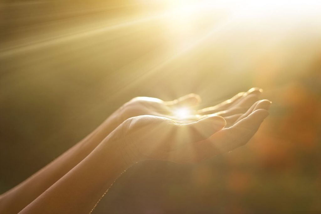 Pair of Hands Catching Sunbeams