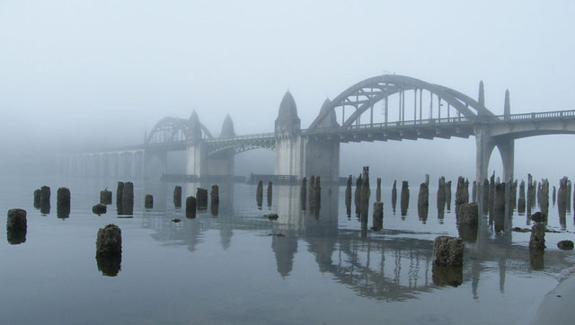 Foggy bridge over the Siuslaw River in Florence, OR.